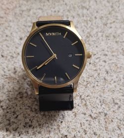 Black and Gold MVMT Mens Watch