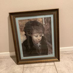 Framed artwork print of "The Crying Boy," signed by Francisco Masseria. Measure: 22.5”x26.5”