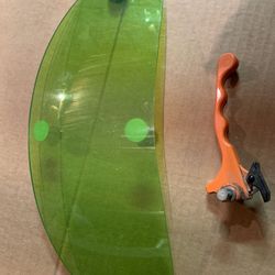 Tinted shield for snowmobile headlight and brake lever