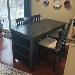 Tall Table With Four Chairs And Bookshelf