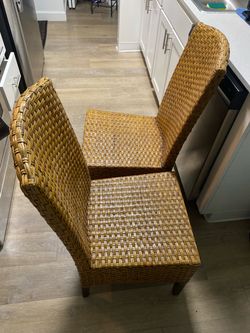 vintage Pier 1 Imports woven rattan dining chairs , which was handcrafted exclusively in Indonesi