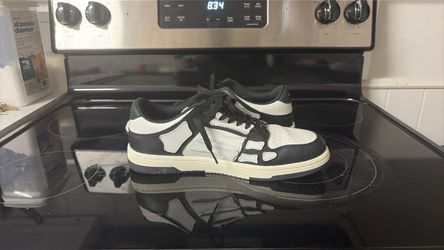 Black and white Amiri’s low tops