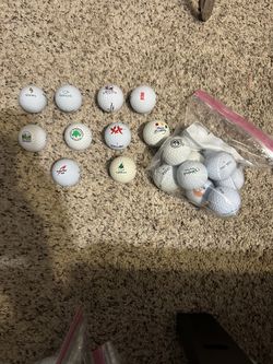 Name brand golf balls with random logos (Courses, restaurants, slogans, brands, etc.)