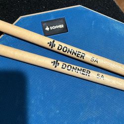 Practice Drum Pad With 2 DrumSticks Set.