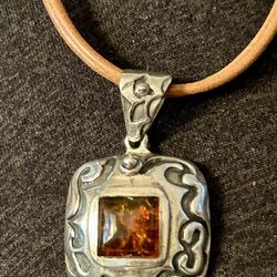 Retired Silpada sterling and amber pendant on leather cord 