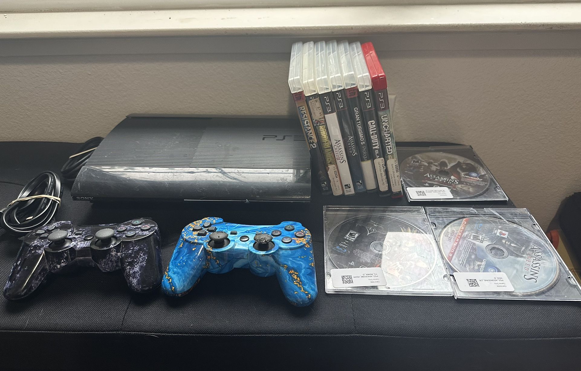 Ps3 Super Slim + 10 Games And 2 Controllers