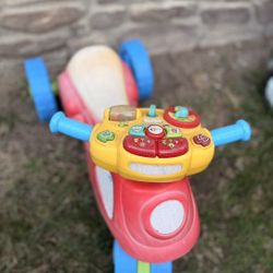 VTech 2-in-1 Learn & Zoom Motorbike, a ride-on toy for toddlers that transforms from a tricycle to a two-wheel balance bike. 