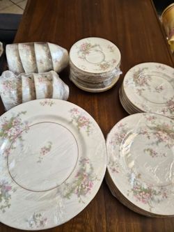 Dinnerware Set with additional plates and tea cups saucers