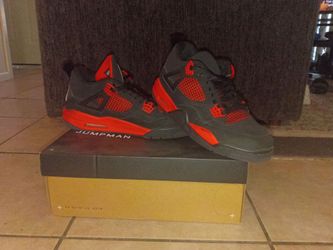 These are the Nike Air Jordan 4 Retro sneakers in the "Red Thunder"
