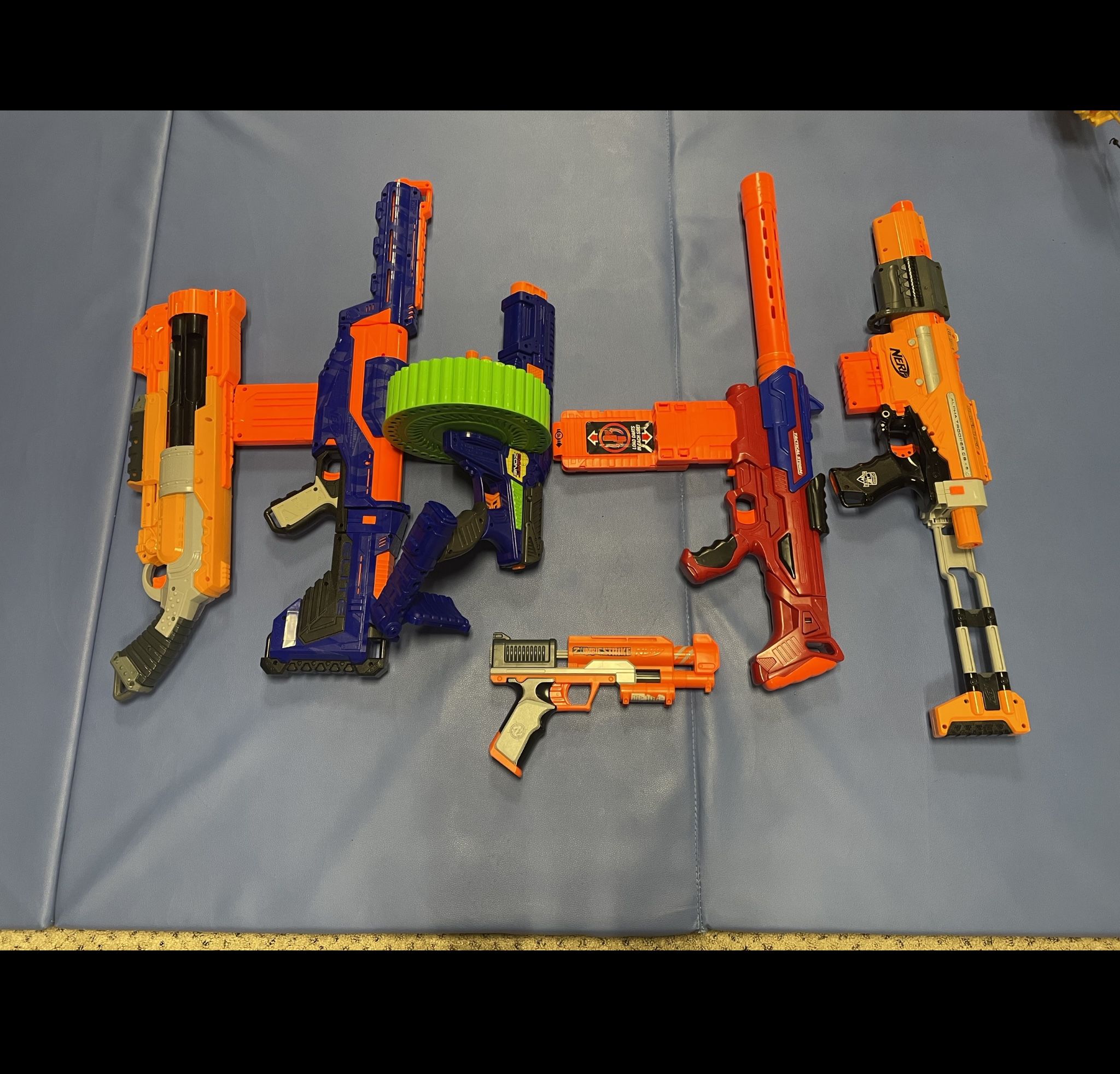 Nerf Guns (6 Manually Operated, 1 Automatic )