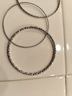 Set of 4 Silver-Tone Twisted Bangle Bracelets - $10