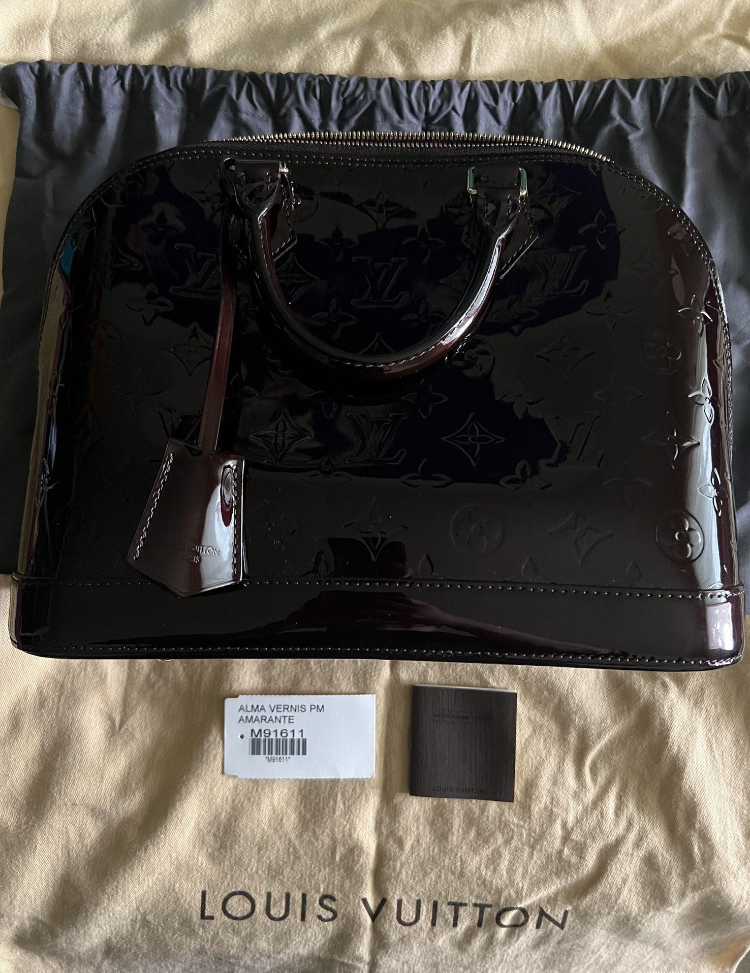 Authentic Amarante Vernis Louis Vuitton Alma PM