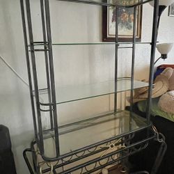 $140  Iron and glass shelve  wine rack good condition  72 " tall 38 wide 