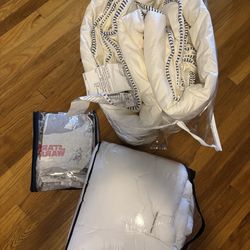 Twin size beddings: Pottery Barns Star Wars sheets set, IKEA comforter, and a mattress topper