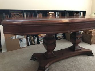 Pedestal wood table with green pads and extension s to make larger.size: 7x42seven long