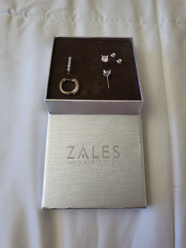 Zales two  sets Of diamond earrings Zales never been  warn