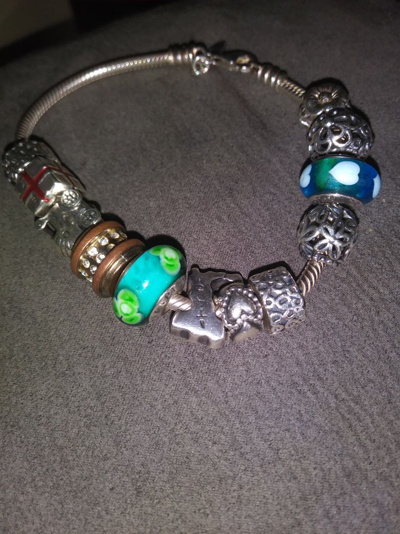 Pandora bracelet and 12 charms.