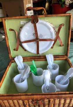 Picnic whiker basket with 6 plates and 6 cups and utensil.