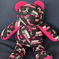 This is a handmade teddy bear crafted from fabric featuring a breast cancer awareness theme 18-inch