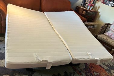 2 IKEA white twin size Meister mattresses