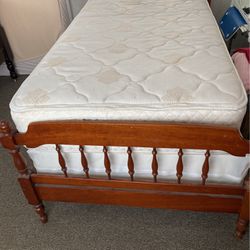 Twin bed with boxspring, mattress, headboard, footboard, and side rails