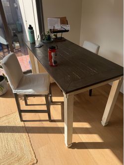 Ashley furniture kitchen table with storage and two chairs