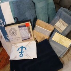 Five towels, eight washcloths, a shower curtain and a bath mat