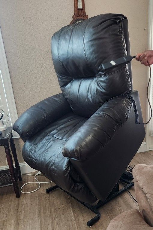 Recliner Dark Brown  Leather  $125.    o
