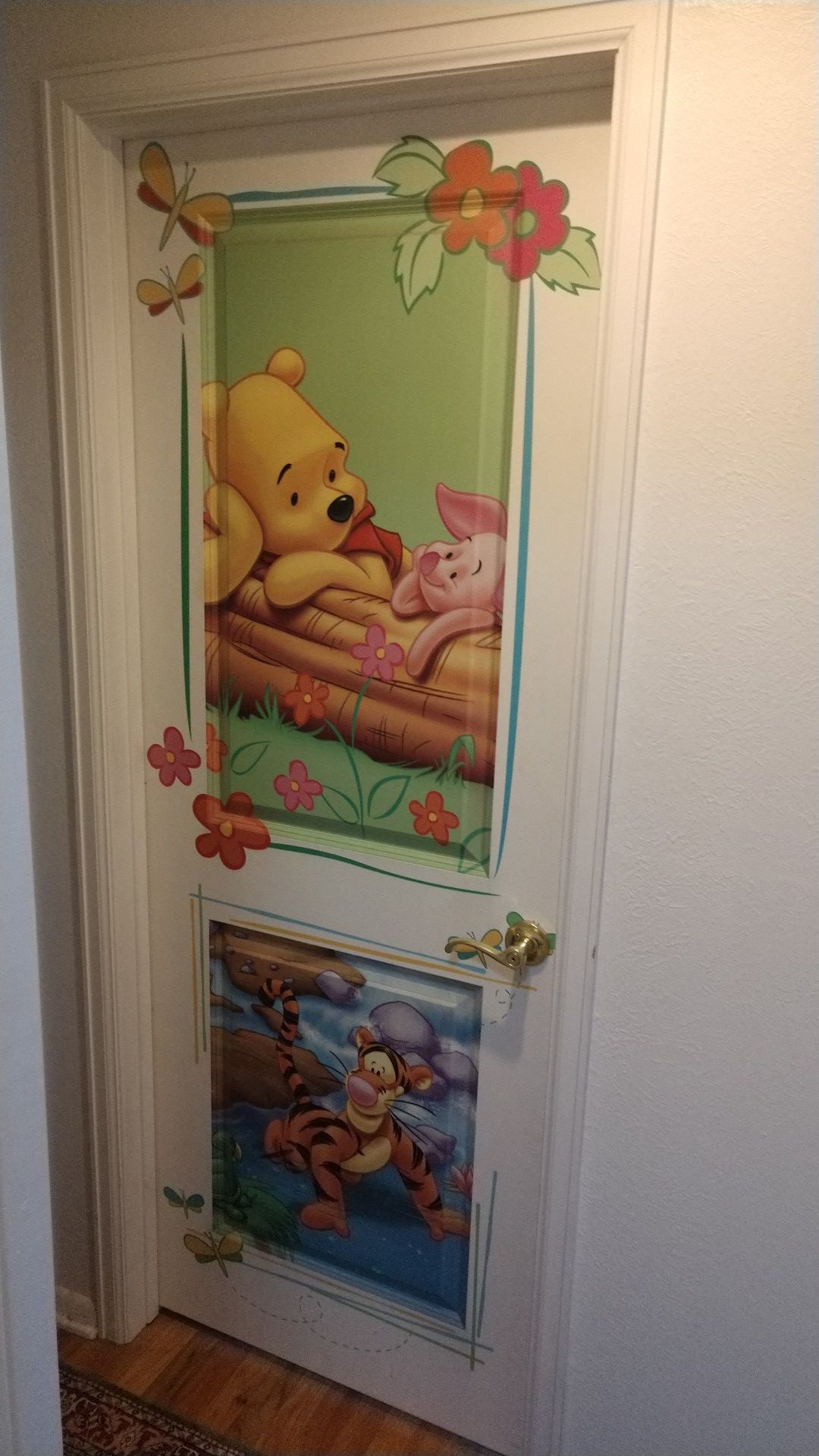 Bedroom door Winnie the Pooh and Tigger and Buzz Lightyear on the other side
