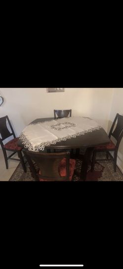 Kitchen table , red chairs asking for 400 i bought it for 770