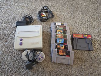 Super Nintendo With Games And Game Genie