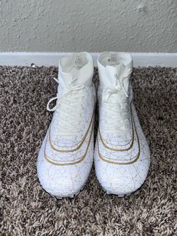 White and gold track spikes size 10.5