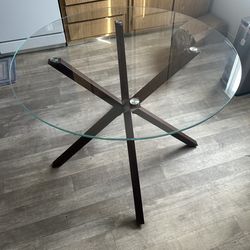 Circular glass dining table