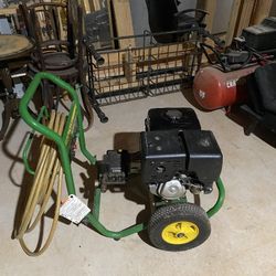 Green and Black Pressure Washer with Yellow Wheels