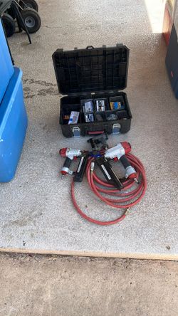 Three nail guns with hose and a lot of accessories