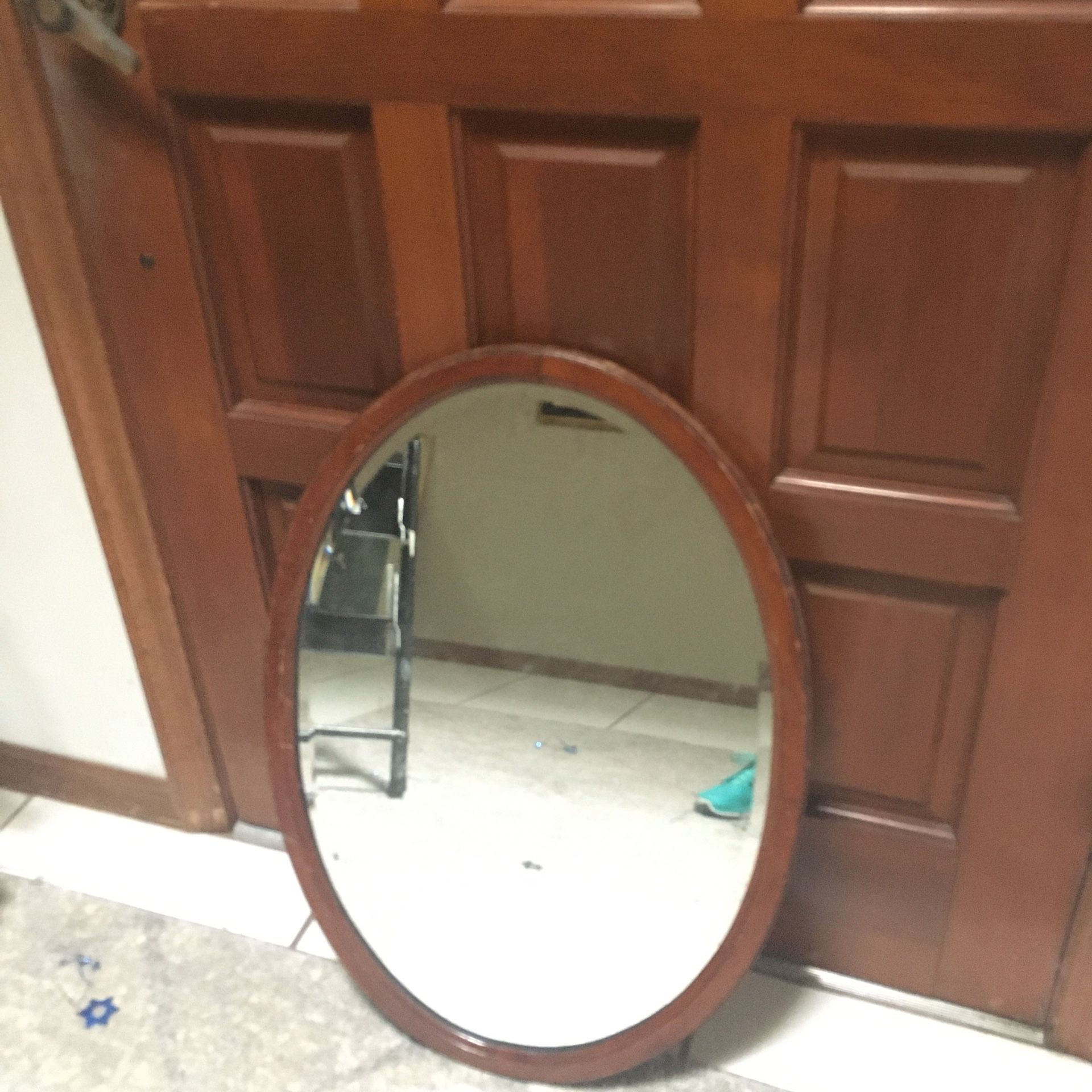 Antique oval beveled mirror and wood frame