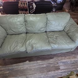 Green sofa and love seat