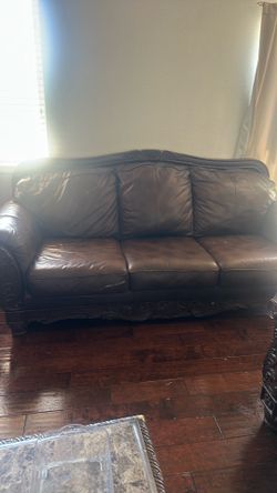 Two brown couches.