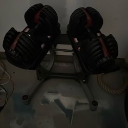 Bow flex dumbbells with rack stand up to 52 pounds each