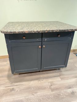 Kitchen cabinet with marble top