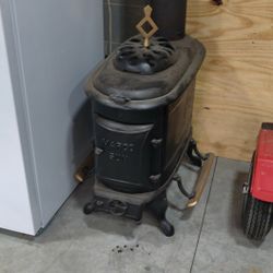 Antique Wood Stove And Four Sections Of Insulated Pipe. 