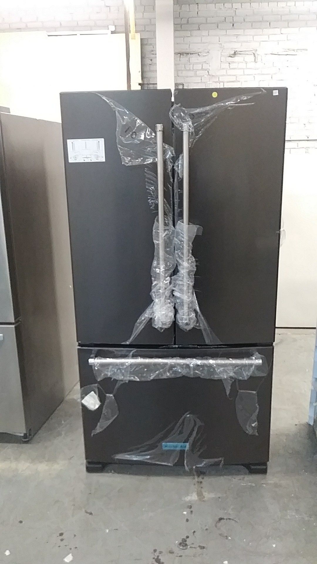New KitchenAid black stainless steel fridge