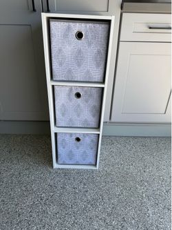 Cabinet with pull out bins