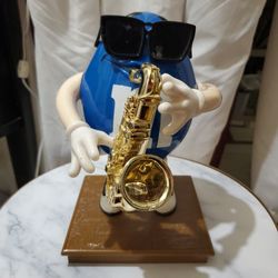 Blue Saxophone M&M Figure On Pedestal