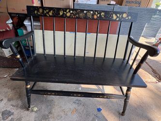 Vintage wooden bench with fruit stenciling