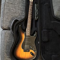 Fender squire electric guitar with case and strap