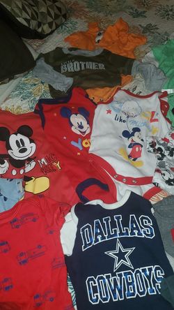 35 shirts and outfits.....good condition