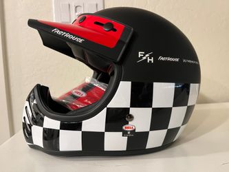 The Bell Moto-3 Fasthouse Checkers off-road motorcycle helmet