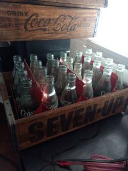 1960s coca cola bottles and crates and seven-up crate
