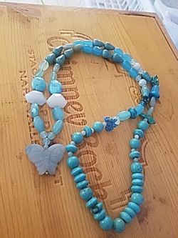 Turquoise long beautiful necklace with buttery
